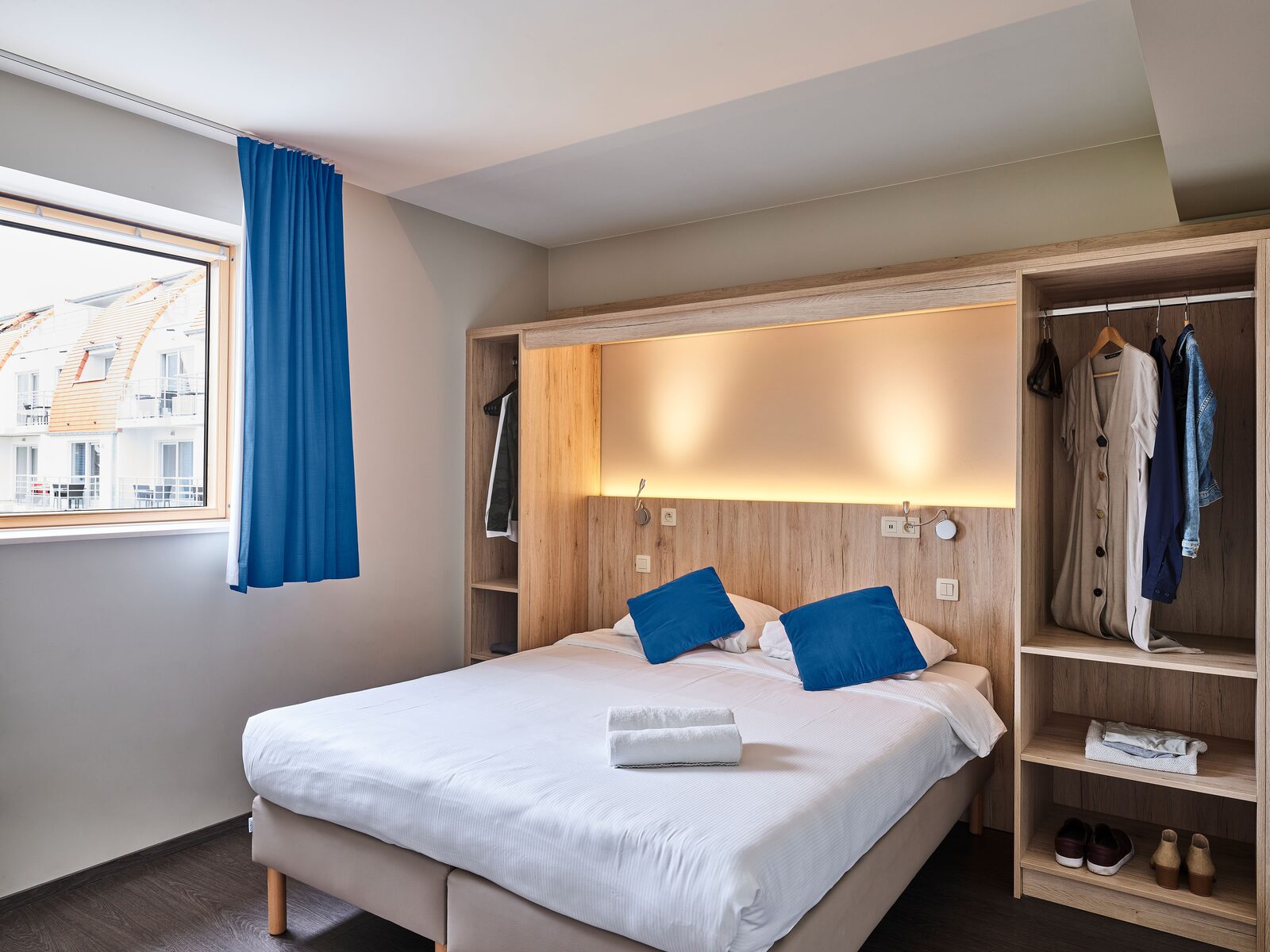 Een slaapkamer in een Comfort Suite van Holiday Suites