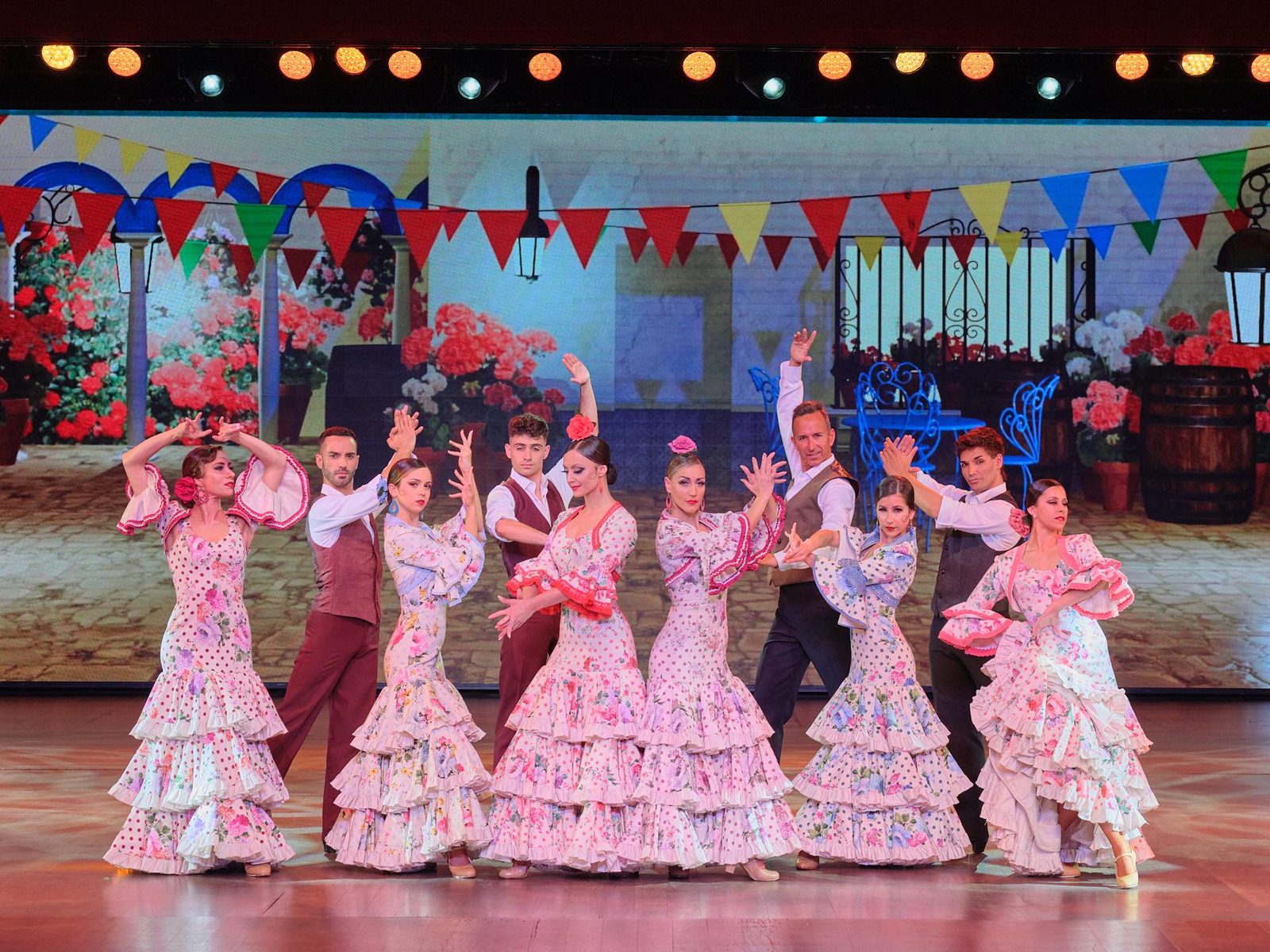Group of Flamenco dancers in traditional flamenco dresses during the AIRE show at Benidorm Palace