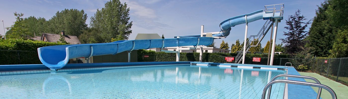 Outdoor swimming pool with slide